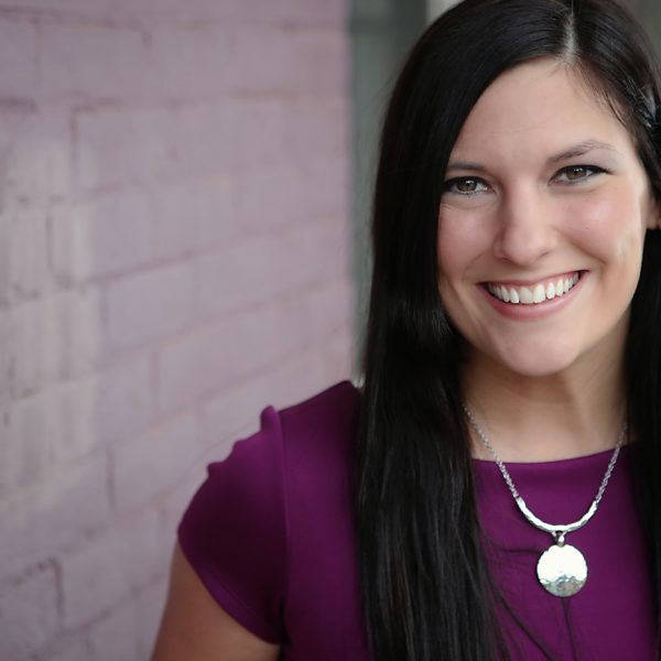 woman smiling with purple dress