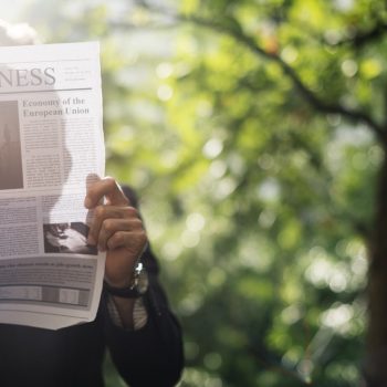 person holding a newspaper