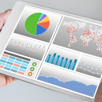 person viewing graphs on a tablet