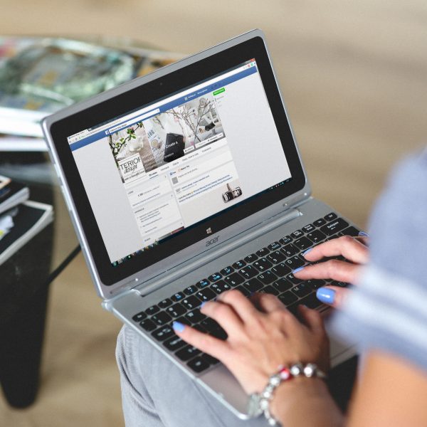 woman typing on laptop