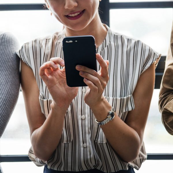 Three people on messaging on cell phones