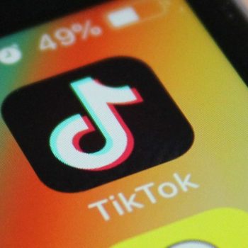 TikTok logo on a phone screen