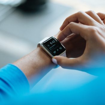 Close up of someone looking at a calendar notification on their smart watch