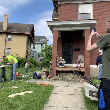 Picture of people doing construction work on a house