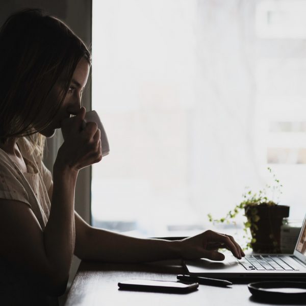 A woman sips her morning coffee to jump start her day