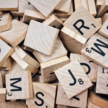 Pile of messy Scrabble letter tiles