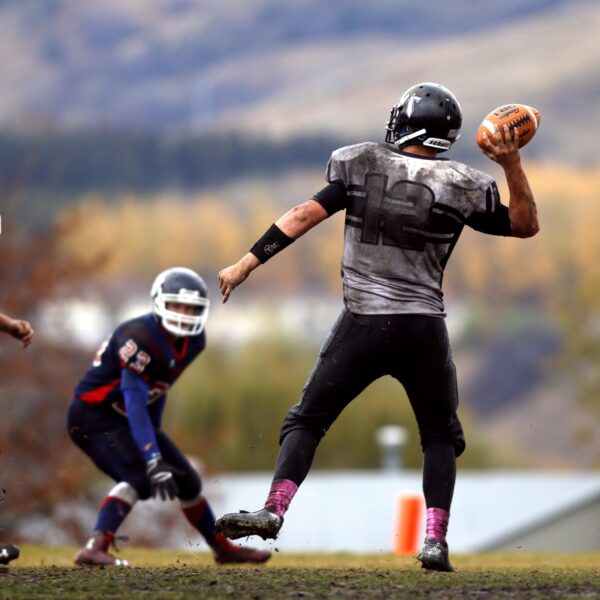 Football Player Throwing Ball