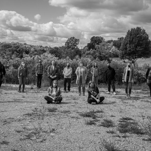 Black and white Scooter Media team group photo outdoors