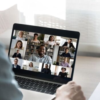 Person at a computer participating in an online meeting