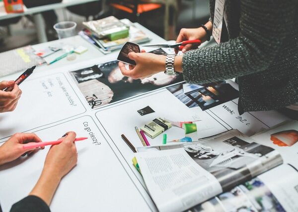 Graphic designers looking over the layout of a publication