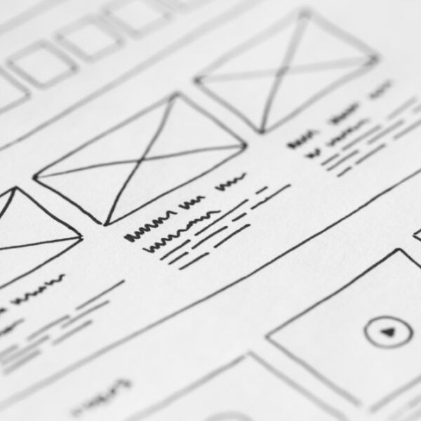 Rough draft of a design project with sketches of black and white boxes