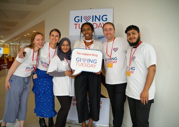 Group of supporters wearing #GivingTuesday t-shirts