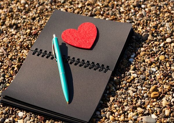 Black notebook with heart on it