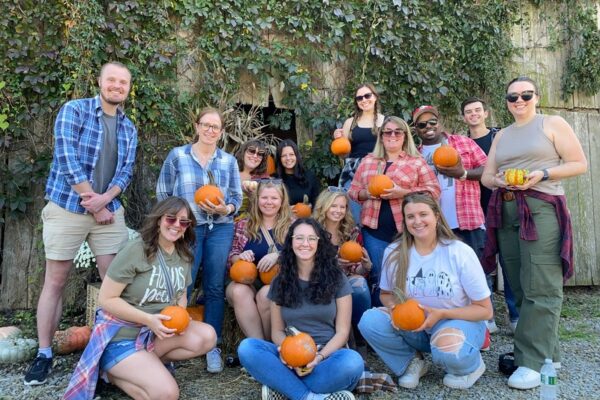 The Scooter Media team posing for a photo at Flannel Fest 2024.